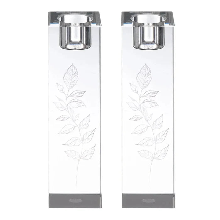 Two white Kosel Hadlokas Neiros candle lighting cards with leaf designs and gray metal clips for holding during Shabbat prayers.
