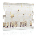 Kosel Sculpture by Judy displayed on white shelf with brass accents and decorative items, modern tabletop art piece