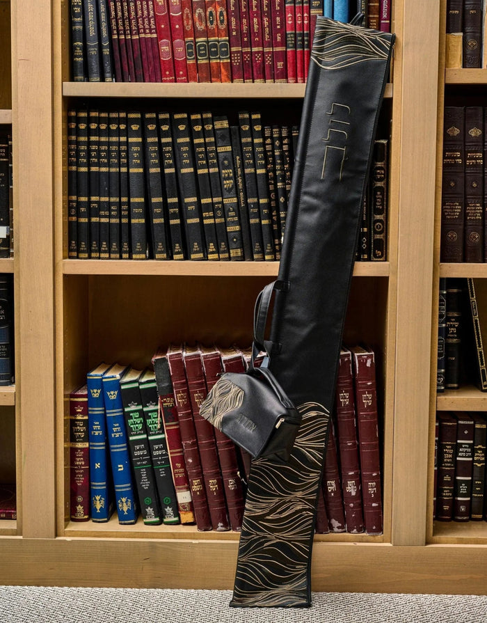 Black lace lulav (לולב) holder standing upright with attached coordinating esrog bag, showing the gold lattice lace detailing, for Sukkot
