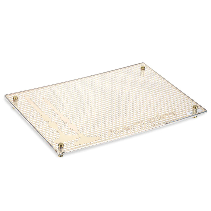 Laser cut hadlokas neiros tray with cream-colored mesh surface and metal corner brackets for Shabbat candle lighting.