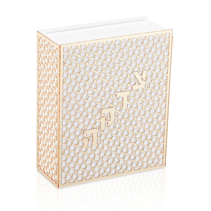 Laser cut tzedakah box in cream with geometric pattern design, a Jewish charitable giving box by Waterdale Collection.
