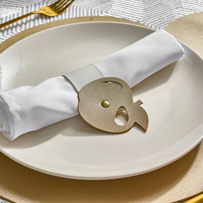 Gold leather apple napkin wrap on a Rosh Hashana place setting