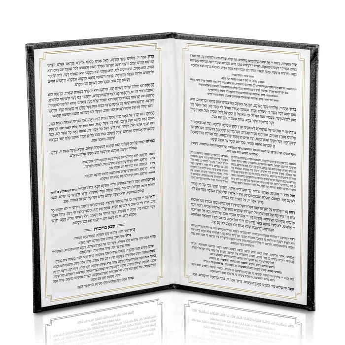 Black leather Bencher with gold accents, open to show interior pages of Birchat Hamazon blessings text, elegant Jewish prayer book for Shabbat.