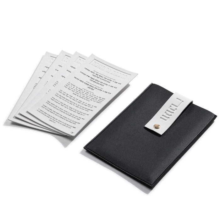 Black and white Chanukah Brachos Card Set with the four cards laid out beside their leather pouch