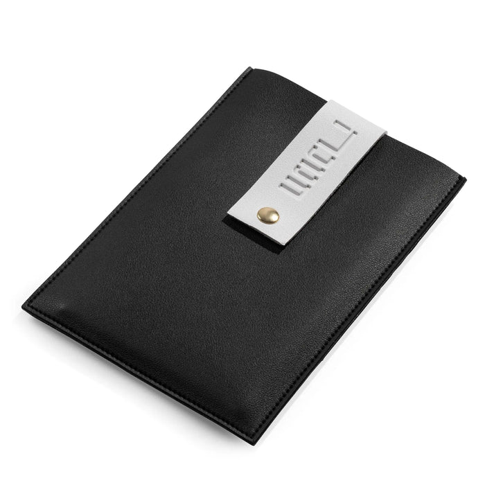 Black leather pouch holding the Chanukah brachos cards, closed and ready to store until next Chanukah