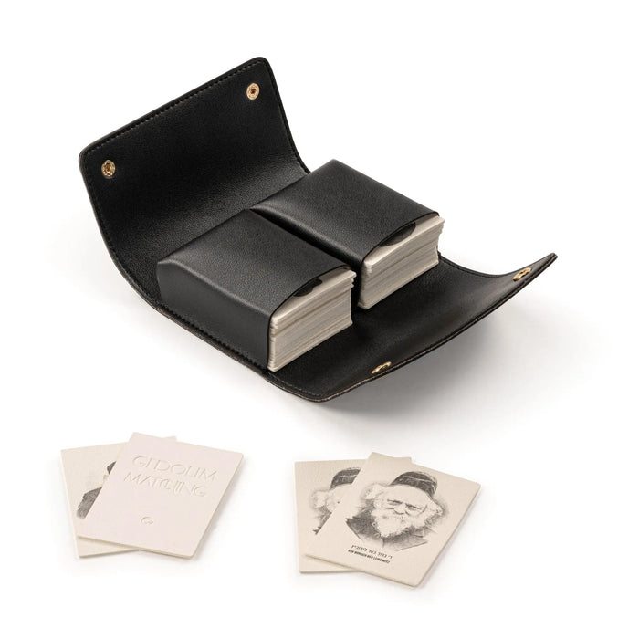 Black leather Gedolim matching game with open case displaying card pairs, ideal for family game nights and Jewish education.
