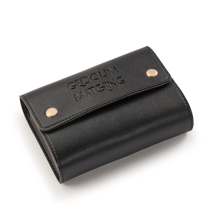 Black leather Gedolim Matching Game by Waterdale Collection with snap closures and gold hardware, compact travel-size design.