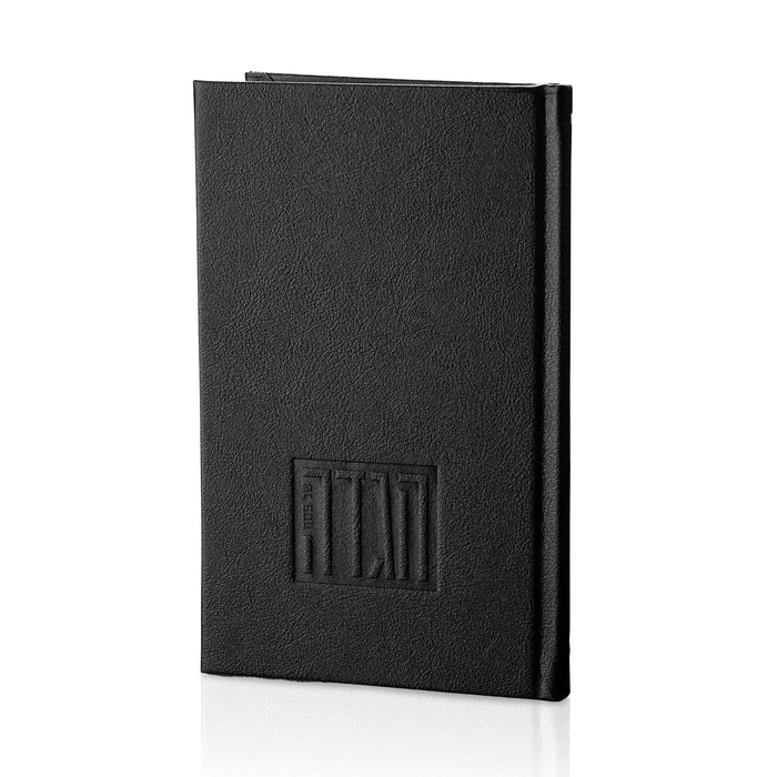 Black leather Haggadah with embossed design detail on cover, closed spine view for Pesach holiday use.