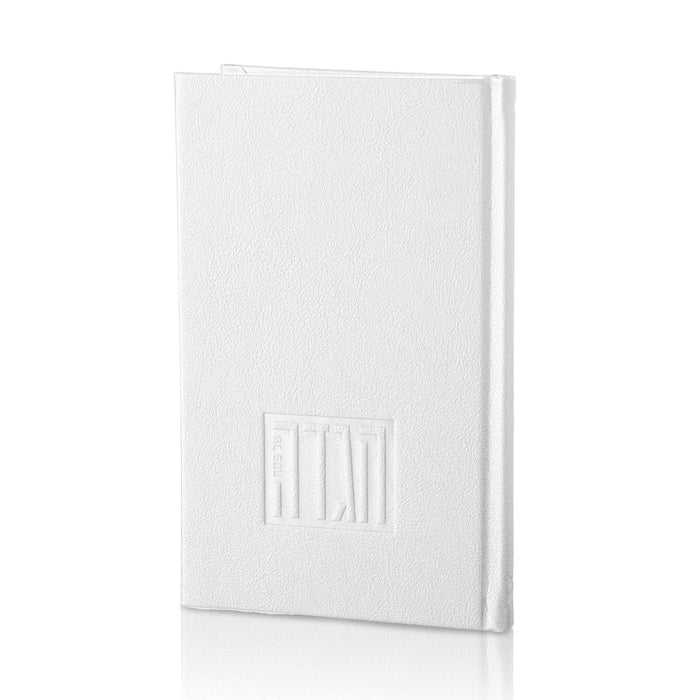 White leather Haggadah with embossed design on cover, closed binding, perfect for Pesach table settings and holiday use.
