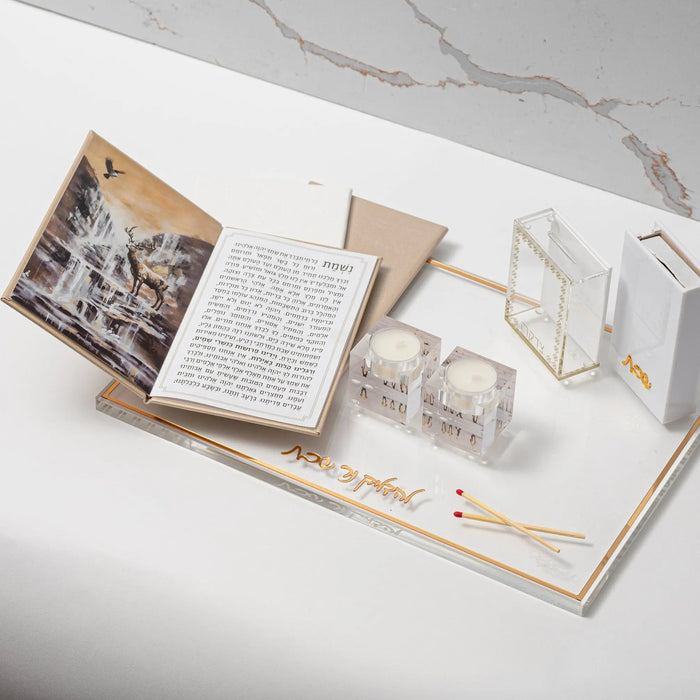 Leather Painted Nishmas Booklet in tan with open pages showing text and decorative designs, displayed on white surface with matching accessories.
