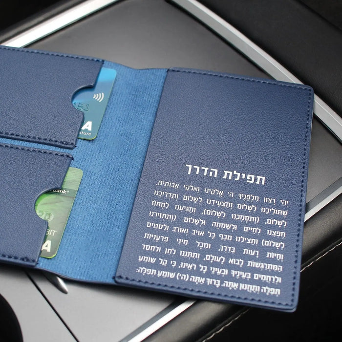 Blue leather passport case with document pocket and card slots, displayed open to show interior organization and Hebrew text on cover.