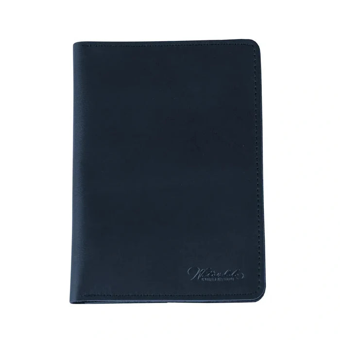 Black leather passport case by Waterdale Collection with embossed logo detail, compact travel wallet design.