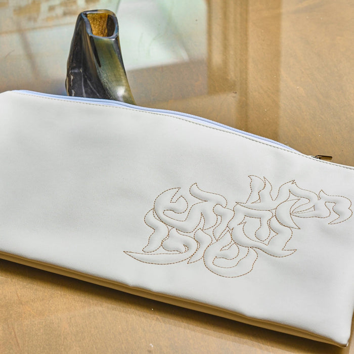 White leather shofar bag with gold lettering for Rosh Hashana