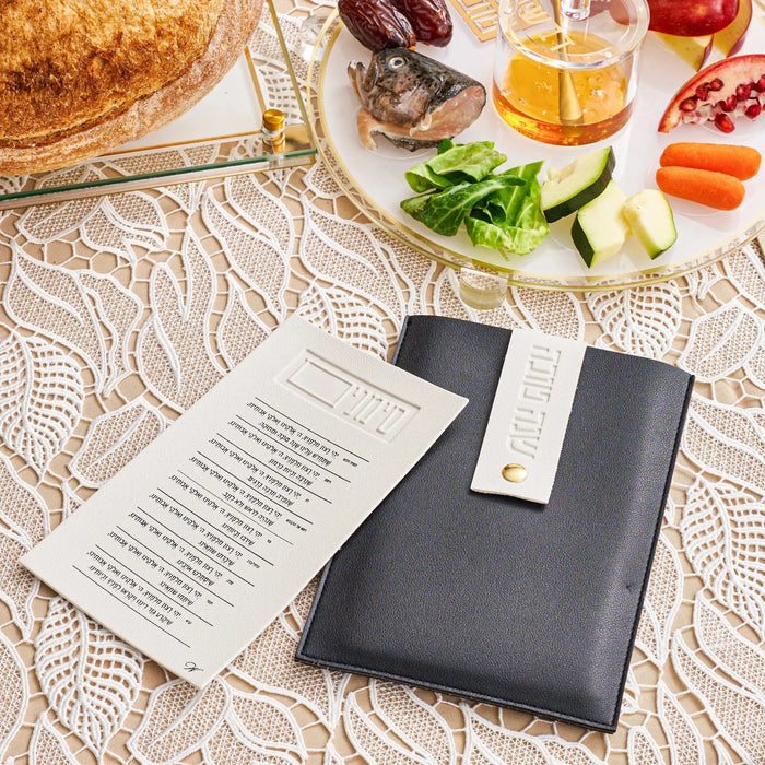 White & Black Simanim pouch with cards, styled for Rosh Hashanah decorations