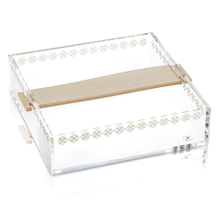 Clear acrylic napkin holder with leather strap handles and gold metal accents, featuring a light wood divider and diamond pattern detailing on sides.