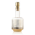 Linear Wine Decanter with textured glass body and brass-tone base and stopper, displayed against white background.