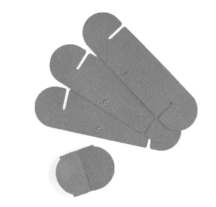 Four gray leatherette Loop Leather Napkin Wraps by Waterdale Collection arranged in a fan pattern, ideal for Shabbat and holiday table settings.