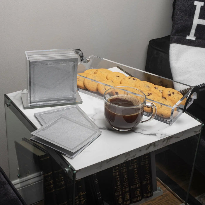 Waterdale Collection luxe bread tray in brushed metal with white marble top, styled with fresh bread and beverages for Shabbat entertaining.