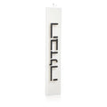 Minimalist Havdalah candle with vertical "LCHD" text on white rectangular holder, modern Jewish holiday candle design.