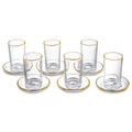 Set of six modern glass kiddush cups with matching saucers, featuring clear glass and gold-tone rim details from Waterdale Collection.