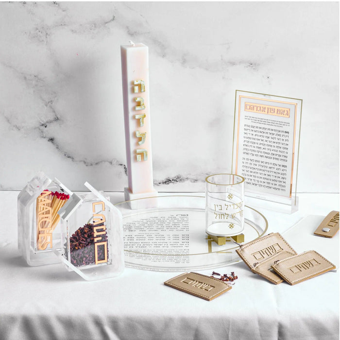 Waterdale Collection leather besamim pouch multipack displayed with packaging and product cards on marble surface for Shabbat gifting.