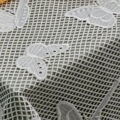 Onyx Butterfly Tablecloth in white leather mesh with embroidered butterfly motifs throughout the fabric pattern.