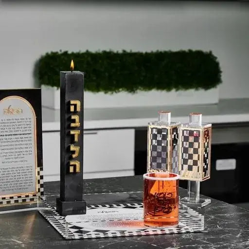 Onyx Havdalah plate with compartments displaying spices, candle holder, and wine cup on black tray for Shabbat ceremonies.