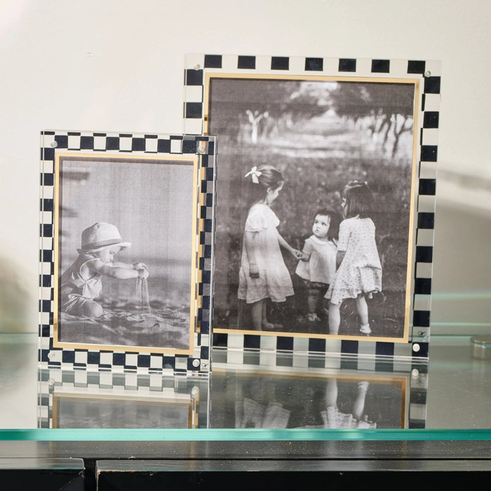 Waterdale Collection onyx picture frame with black and white checkered border displaying family photos on tabletop.
