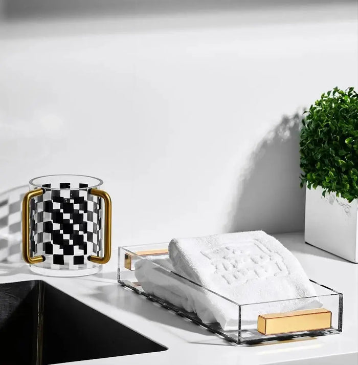 Onyx Washing Cup from Waterdale Collection displayed on white vanity counter with checkered design accent and spa-like bathroom setting.