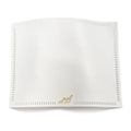 White linen challah cover with open hemstitch embroidery detail and gold accent, folded flat display view.