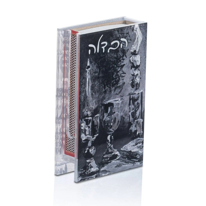 Black painted Havdalah matchbox holder with decorative artwork, displayed with packaging box against white background.