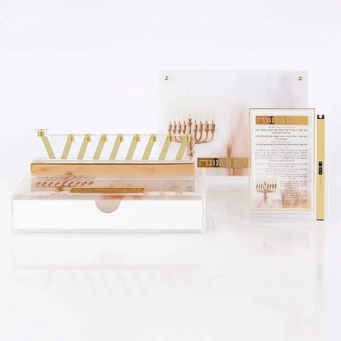 A Waterdale Collection Chanukah display - a painted Lucite menorah tray, a gold menorah, a printed brachos tabletop and a lighter, set for candle lighting