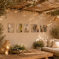 Painted by Batya five-panel Lucite sukkah set under a string-lit bamboo roof with olive branches, for Sukkos (סוכות)
