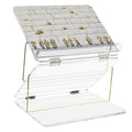 Painted by Judy foldable shtender with open compartments displaying religious items, featuring a tilted reading surface and storage drawer in cream and tan tones.