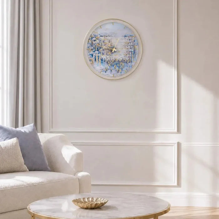 Waterdale Collection Painted by Yosefa Kosel wall clock with blue watercolor design displayed in modern living room above white side table