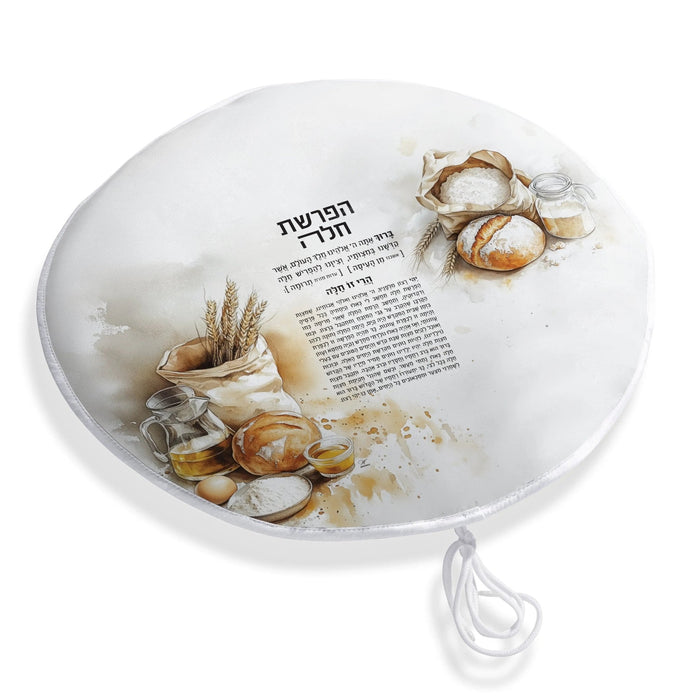 Painted Hafrashas Challah Cover in gold leather with watercolor floral design, displayed on white surface with matzah and challah bread for Shabbat.