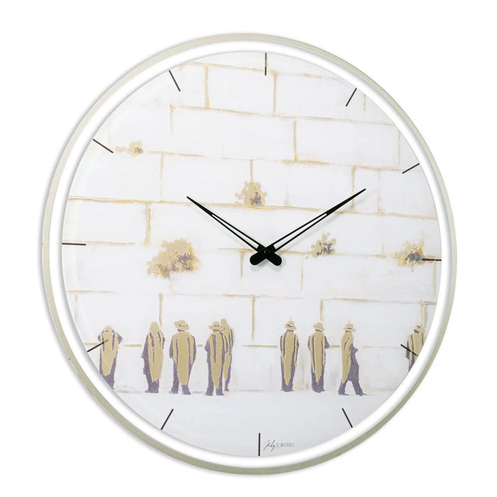 Painted Kosel wall clock by Judy featuring white face with golden figures silhouettes and hour markers, modern minimalist design for home decor.