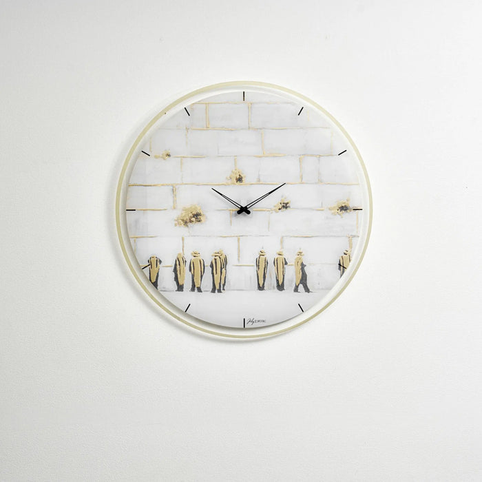 Painted Kosel wall clock with white face, gold-toned numerals and hands, featuring decorative elements on a light background.