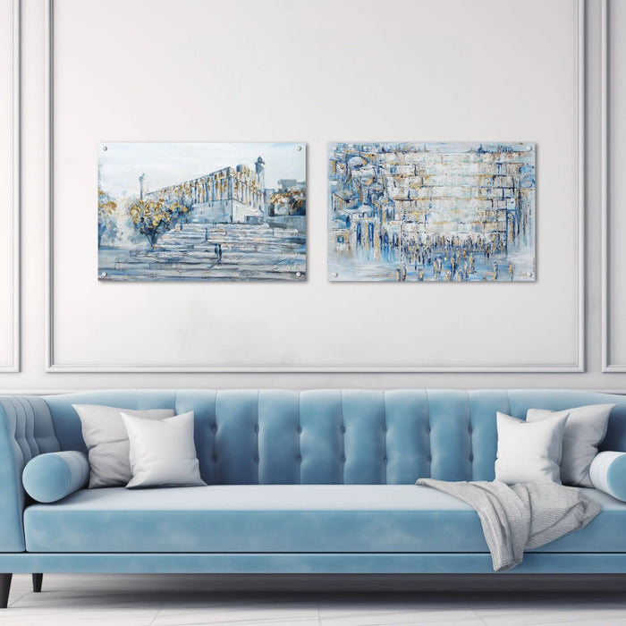 Blue-toned Painted Kosel wall art by Yosefa featuring Jerusalem landscape architecture above a modern light blue sofa with white pillows.