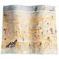 Gray and gold painted leather Challah cover with abstract brushstroke design and Hebrew text detail for Shabbat table.