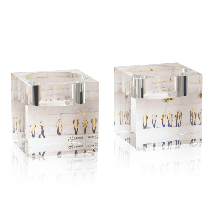 Two painted Kosel tea light holders with cream and gold details, featuring Jerusalem cityscape designs for Shabbat candle lighting.