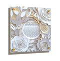 Papercut Hadlakas Neiros wall art featuring layered white and gold paper flowers with Hebrew prayer text in center circle, 16x20 Shabbat wall decor
