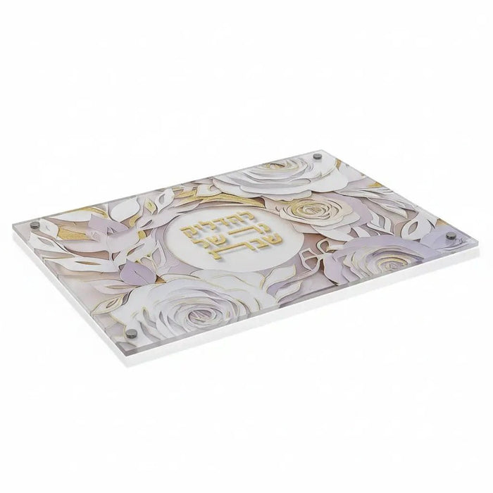 Papercut Hadlokas Neiros tray with intricate floral and Hebrew design in purple and gold tones on white ceramic base for Shabbat candle lighting.