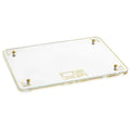 Pearlstone Challah Board with gold accents and leather handles on white pearl marble surface, elegant Shabbat tabletop serving piece.