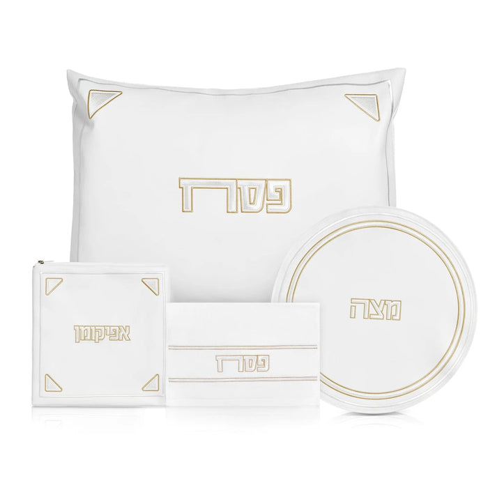 Pearlstone Pesach set with white leather items and gold accents, including pillow, placemat, plate, and napkin holder for holiday table settings.