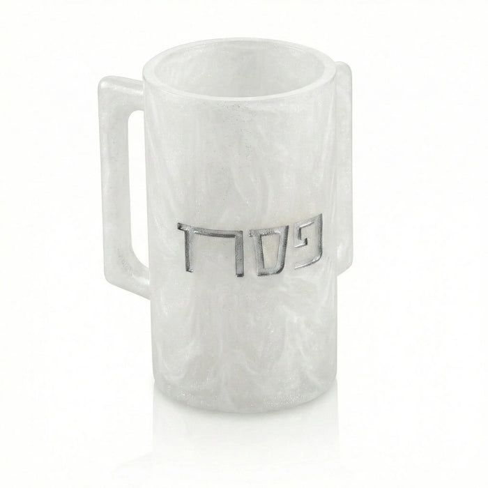 White resin Pesach washing cup with Hebrew letters and a handle, displayed on a neutral background.