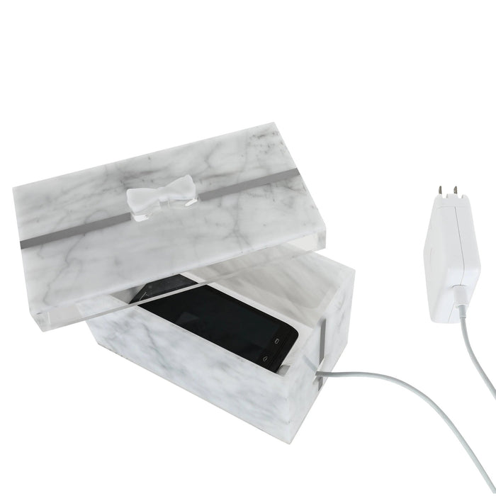 Marble present box with clear acrylic lid displaying smartphone charging cable, tabletop organizer by Waterdale Collection.