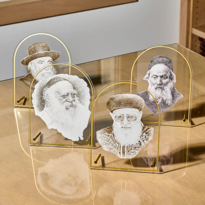 Chofetz Chaim tabletop gadol sketch in clear acrylic frame displaying black and white portrait illustration on wooden surface