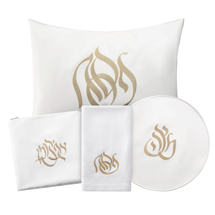 Regal Pesach Set in white and gold leather featuring matching pillow, napkins, and round plate for holiday table décor.
