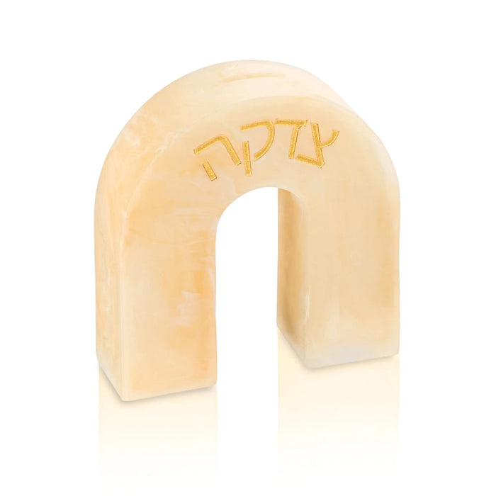 Cream-colored resin arch tzedakah box with embossed text, featuring a modern curved design for charitable giving and Jewish home decor.